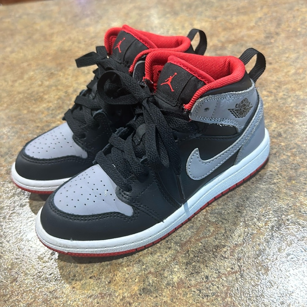 Jordan 1 mids lblack, white, gray & red.  Size 12